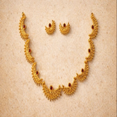TJ003 Intricate gold crescent necklece set with red gemstones