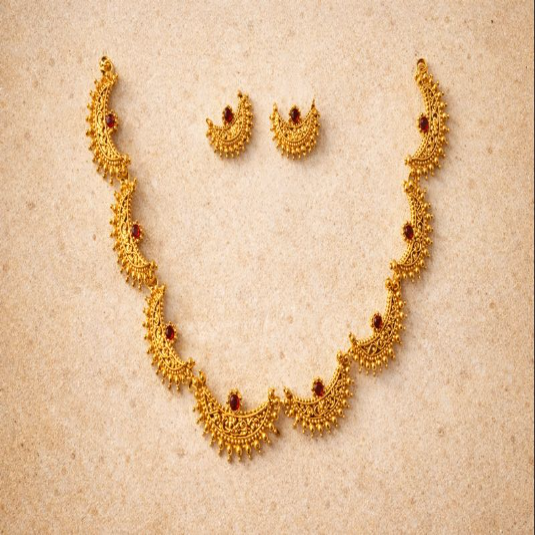 TJ003 Intricate gold crescent necklece set with red gemstones