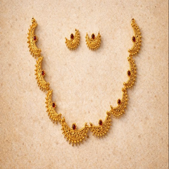 TJ003 Intricate gold crescent necklece set with red gemstones